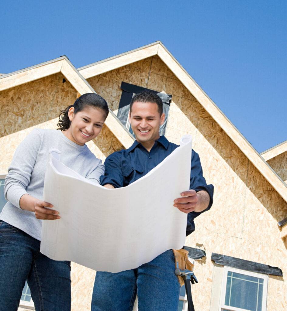 A couple looking at a blueprint